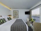 Deluxe suite bedrrom high res.jpg